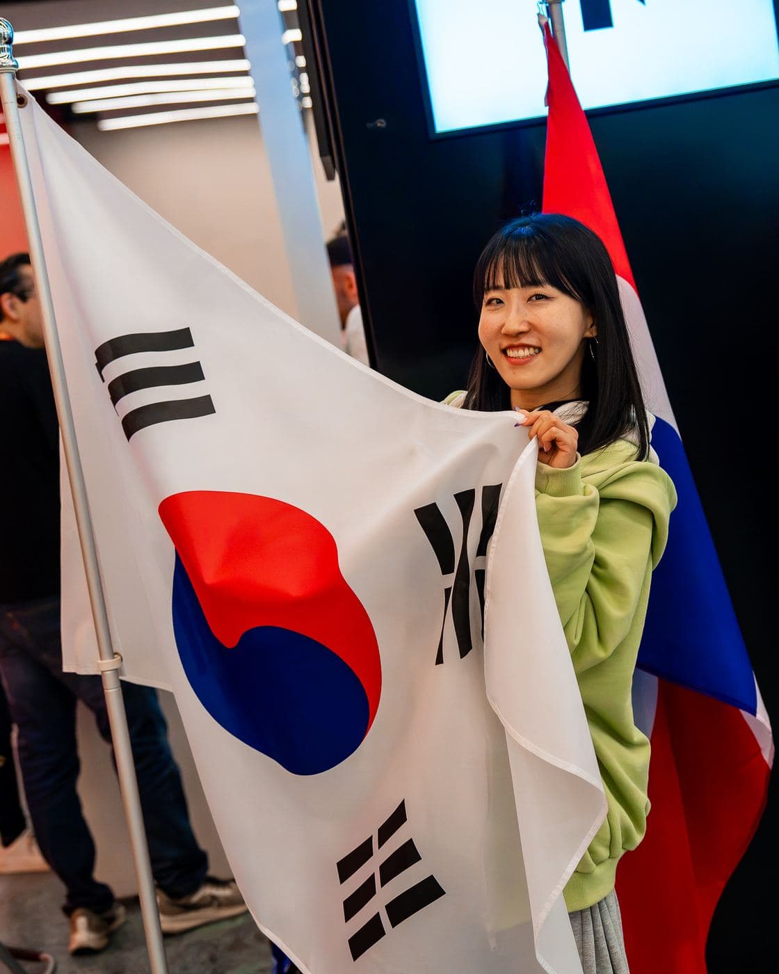 A dancer holding the flag of South Korea